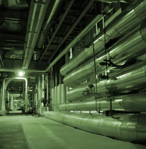 Insulated chilled water pipework running through a data centre cooling plant room