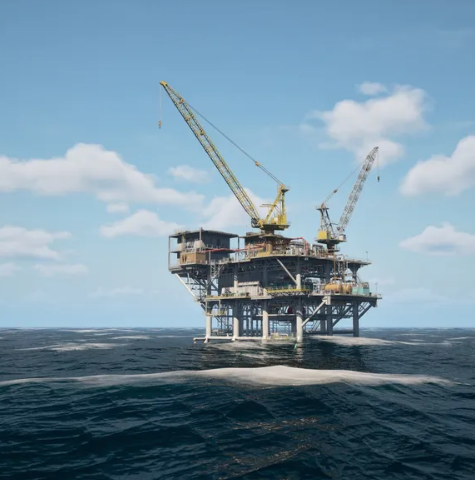 Offshore oil and gas platform with cranes standing in open sea